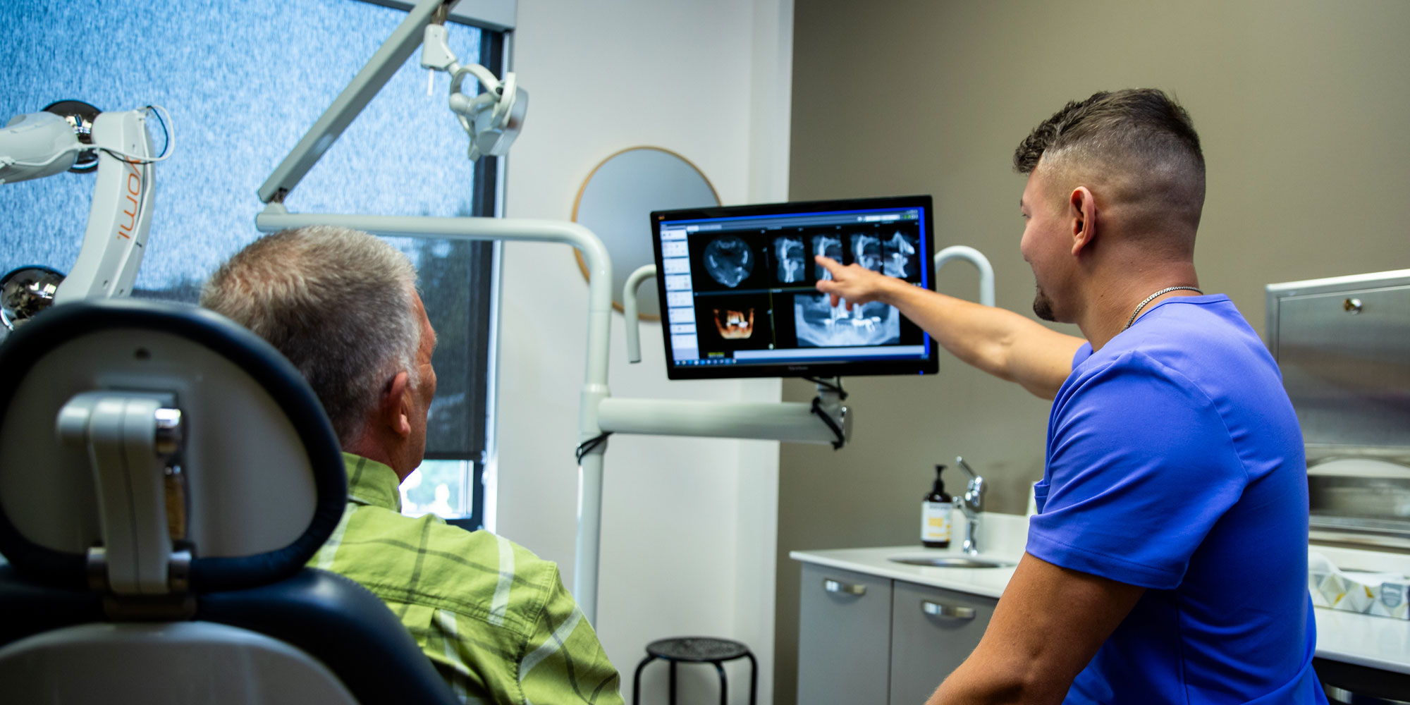 curtis with dr rav discussing implant science